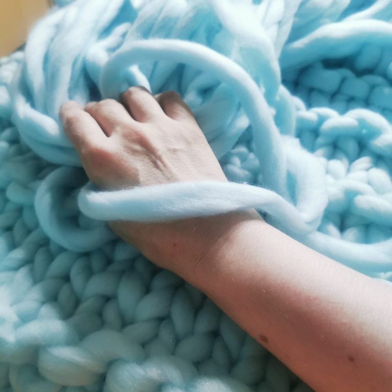 Unique thick wool hand-knitted blanket with a double strand pattern from the Adventures in Wool at Bord Du Lac Artisans.